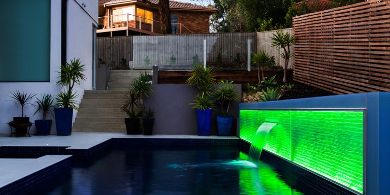 Formed Vision. Water feature in Aqua pattern. LED lit in green
