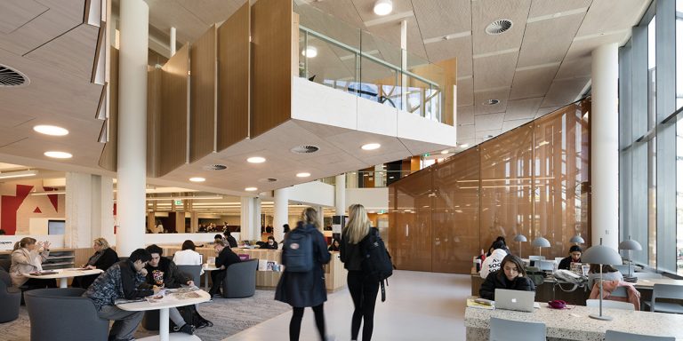 SEFAR mesh laminated glass custom printed orange. Monash University Caulfield library by John Wardle Architects